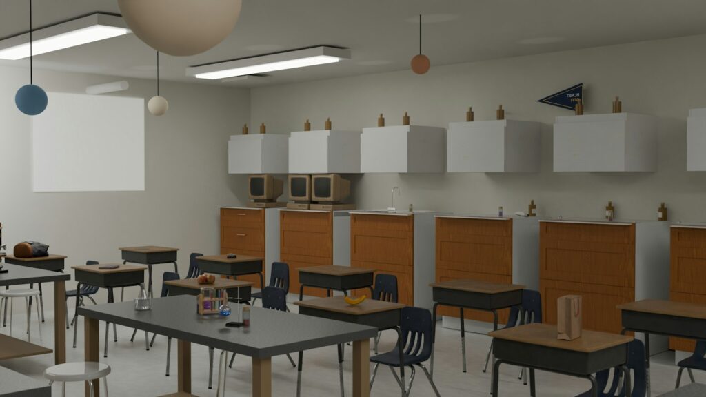 Empty classroom with desks, chairs, computers and a screen, reflecting technology in schools